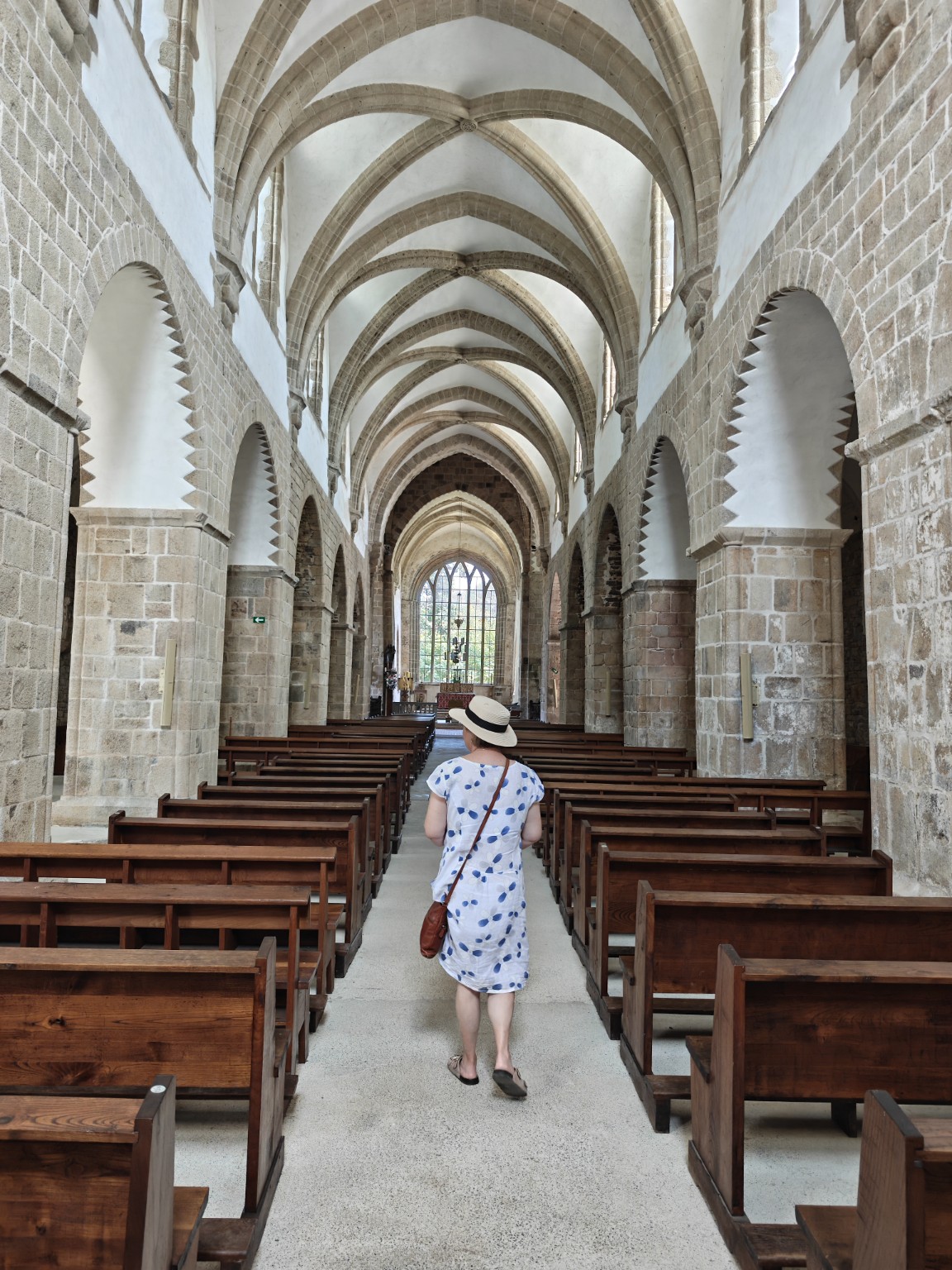 The stone-vaulted nave inside La Lucerne Abbey